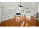 Expansive living room showcasing an open layout with hardwood floors and abundant natural light at 13004 Bell Creek Chase, Riverview, FL 33569