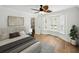 Cozy main bedroom with natural light from a bay window and a walk-in closet. Light wood floors at 13004 Bell Creek Chase, Riverview, FL 33569