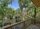 Scenic river view from the porch surrounded by lush greenery, offering a peaceful and serene outdoor space at 13004 Bell Creek Chase, Riverview, FL 33569