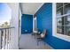 Balcony with seating and beautiful blue exterior walls at 13117 4Th E St, Madeira Beach, FL 33708
