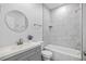 Cozy bathroom features a tub, shower, and grey vanity with neutral countertops at 13117 4Th E St, Madeira Beach, FL 33708
