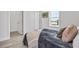 A spacious bedroom with modern floors and fresh paint offers a relaxing retreat at 13117 4Th E St, Madeira Beach, FL 33708