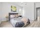 This bedroom features ample natural light, and modern floors at 13117 4Th E St, Madeira Beach, FL 33708