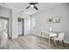 Modern bedroom features wood-look floors, closet and desk with chair, and natural light at 13117 4Th E St, Madeira Beach, FL 33708