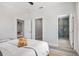 Bright bedroom features a modern design with a walk-in closet and ensuite bathroom at 13117 4Th E St, Madeira Beach, FL 33708