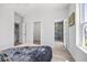 Bright bedroom features hardwood floors, closet, and an ensuite bathroom at 13117 4Th E St, Madeira Beach, FL 33708
