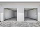 Spacious two car garage with stone paver driveway and bright white walls at 13117 4Th E St, Madeira Beach, FL 33708