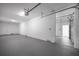 Spacious garage with sectional garage door and adjacent room at 13117 4Th E St, Madeira Beach, FL 33708