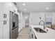 Modern kitchen with stainless steel appliances, lots of cabinet storage and light-colored counter tops at 13117 4Th E St, Madeira Beach, FL 33708