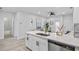 Bright kitchen with stainless steel appliances, a spacious island, and ample counter space at 13117 4Th E St, Madeira Beach, FL 33708