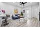 A cozy living room features an open-concept design and flows seamlessly to the kitchen with an outdoor patio at 13117 4Th E St, Madeira Beach, FL 33708