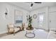 Bright and airy living room boasting a neutral color scheme, stylish furniture, and access to a balcony at 13117 4Th E St, Madeira Beach, FL 33708
