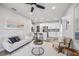 Bright living room with contemporary decor, including an open-concept kitchen, creates an inviting and functional space at 13117 4Th E St, Madeira Beach, FL 33708