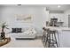 Cozy living room featuring a gray couch and modern art perfect for relaxing and entertaining guests at 13117 4Th E St, Madeira Beach, FL 33708