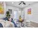 Comfortable living room with a blue couch, a round wooden table, and art pieces on the wall at 13117 4Th E St, Madeira Beach, FL 33708