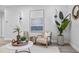 Airy living room with modern artwork, decorative lighting, and comfortable seating at 13117 4Th E St, Madeira Beach, FL 33708