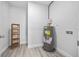 Utility room with a water heater, wood shelf and light gray walls at 13117 4Th E St, Madeira Beach, FL 33708