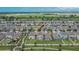 Birds-eye view of a residential area featuring cozy houses with backyard spaces and scenic surroundings at 15718 Fort Island Pl, Sun City Center, FL 33573