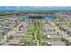 An aerial view showcases the backyard, green space, and walking path near this home at 15718 Fort Island Pl, Sun City Center, FL 33573