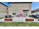 Spacious backyard with a paver patio, outdoor seating, and a grassy area for recreation at 15718 Fort Island Pl, Sun City Center, FL 33573