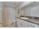 This traditional bathroom offers granite countertops, a tub-shower combination, and plenty of storage space at 15718 Fort Island Pl, Sun City Center, FL 33573