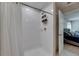 Bright and clean bathroom with a shower, and open to the main bedroom at 15718 Fort Island Pl, Sun City Center, FL 33573