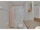 Bright bathroom featuring a shower-tub combination and granite vanity at 15718 Fort Island Pl, Sun City Center, FL 33573