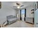 This bright Bedroom features a classic gray crib, modern changing table, and bright natural light at 15718 Fort Island Pl, Sun City Center, FL 33573