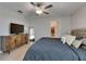 Bedroom featuring a TV console, soft colors, and decor to create a relaxing retreat at 15718 Fort Island Pl, Sun City Center, FL 33573