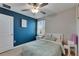Comfortable bedroom features natural light, fan, and well-appointed furniture at 15718 Fort Island Pl, Sun City Center, FL 33573