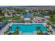 Aerial view of the community pool and playground area in a Gathering-friendly neighborhood at 15718 Fort Island Pl, Sun City Center, FL 33573