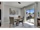 Dining room view with modern lighting and view of the outdoor patio at 15718 Fort Island Pl, Sun City Center, FL 33573