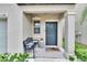 Charming front porch with a stylish bench, decorative planter, and a welcoming doormat at 15718 Fort Island Pl, Sun City Center, FL 33573