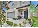 Inviting front porch with elegant pillars, a cozy bench, and meticulously manicured landscaping at 15718 Fort Island Pl, Sun City Center, FL 33573