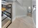 Bright staircase with white risers and light wood treads, leading to the upper level at 15718 Fort Island Pl, Sun City Center, FL 33573