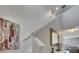 Staircase with white railing, hardwood flooring, and elegant décor, with natural light at 15718 Fort Island Pl, Sun City Center, FL 33573