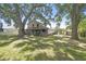 Expansive backyard featuring mature trees, providing a private outdoor space at 16169 Gardendale Dr, Tampa, FL 33624