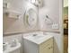 Cozy bathroom features a sink, toilet, with tiled walls and trim at 16169 Gardendale Dr, Tampa, FL 33624