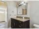 Bathroom featuring granite countertop vanity and a mirror at 16169 Gardendale Dr, Tampa, FL 33624
