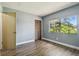 Empty bedroom features laminate flooring, neutral walls, and closet at 16169 Gardendale Dr, Tampa, FL 33624