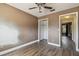 Bedroom featuring wood-look flooring, a ceiling fan, and access to a closet at 16169 Gardendale Dr, Tampa, FL 33624