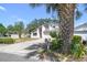 Charming two-story home with a well-maintained lawn and a driveway leading to an attached garage at 16169 Gardendale Dr, Tampa, FL 33624