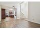 Spacious living room with wood floors and an open concept view of the kitchen and staircase at 16169 Gardendale Dr, Tampa, FL 33624