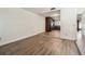 Open concept living room featuring wood floors, with an open view into the kitchen at 16169 Gardendale Dr, Tampa, FL 33624