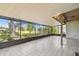 The screened patio offers pleasant views of the property's grounds and lush landscaping at 16169 Gardendale Dr, Tampa, FL 33624