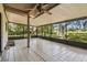 Screened patio with tiled floor provides an inviting space for outdoor entertaining and relaxation at 16169 Gardendale Dr, Tampa, FL 33624