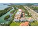 Stunning aerial view of waterfront condos with private docks, pools, and tennis courts, set against a beautiful coastal backdrop at 1695 Pinellas Bayway S # E6, St Petersburg, FL 33715