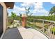 A balcony with views of the community and overlooking lush green landscaping at 1695 Pinellas Bayway S # E6, St Petersburg, FL 33715