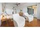 Bright bedroom featuring wood floors and access to a private balcony at 1695 Pinellas Bayway S # E6, St Petersburg, FL 33715