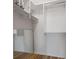 A well-organized closet space with multiple shelves, hanging rods, and a full-length mirror at 1695 Pinellas Bayway S # E6, St Petersburg, FL 33715